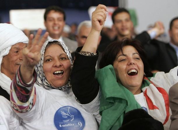 Supporters of Algeria's President Abdelaziz Bouteflika cheer during a presidential