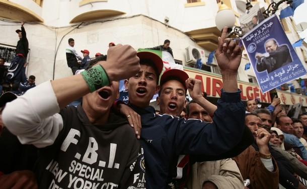 Skikda - Supporters of Algeria's President Abdelaziz Bouteflika chant slogans during his