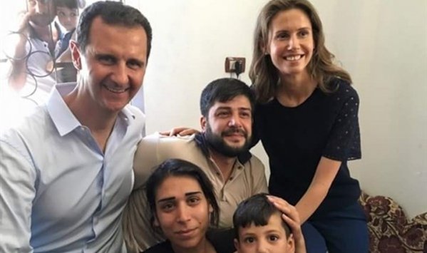 بشار الأسد وزوجته يزوران جرحى الجيش بحمص .. شاهد