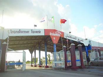 Un coup de bluff à l'indienne                                    ARCELORMITTAL REVIENT SUR SA MENACE DE DEPOSER LE BILAN