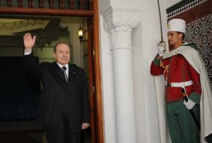 Algerian President Abdelaziz Bouteflika (L) waves as Dutch Foreign