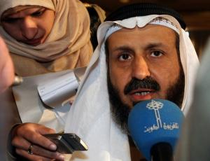 Kuwaiti Oil Minister Mohammad al-Olaim speaks to the media