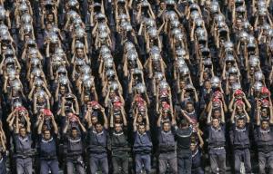 Algerian rescue workers perform in the stands during the