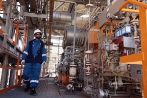 A technician inspects the Krechba gas treatment plant, about