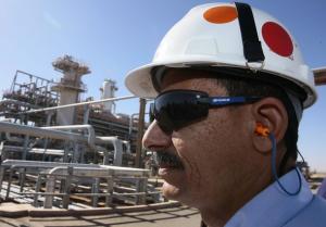 A technician stands at the Krechba gas treatment plant,