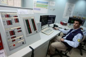 A technician works in the control room of Krechba