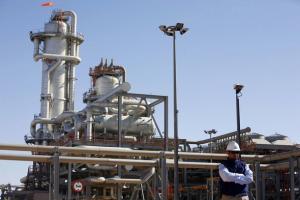 A technician stands at the Krechba gas treatment plant,