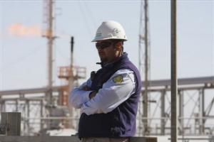 A worker stands at the Krechba gas plant on
