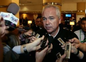 Venezuela's Oil Minister Rafael Ramirez is surrounded by journalists