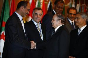 Algeria's President Abdelaziz Bouteflika (2nd R) shakes hand with