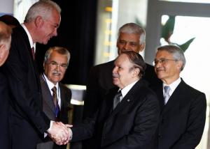 Algeria's President Abdelaziz Bouteflika (2nd R) shakes hands with
