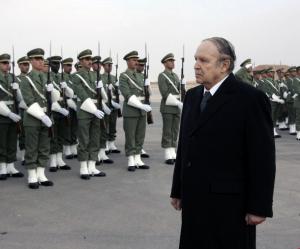 Algeria's President Abdelaziz Bouteflika reviews a guard of honour