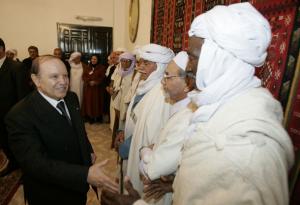 Algeria's President Abdelaziz Bouteflika (L) shakes hands with dignitaries