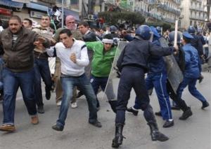 Protesters escape riot police officers Friday, Jan. 9, 2009
