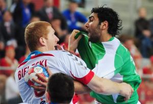 Berriah Abderrahim (R) from Algeria fights for the ball
