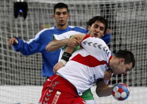 Daniel Zoltak (R) of Poland fights for a ball