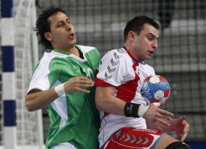 Daniel Zoltak (R) of Poland fights for the ball