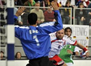 Poland's Mariusz Jurasik, center, performs a wing shot between