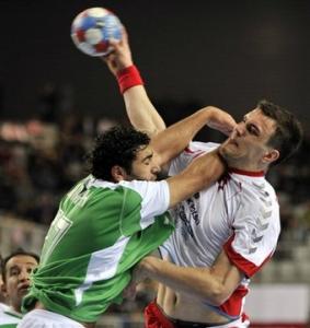 Algeria's Abderrahim Berriah, left, and Poland's Daniel Zoltak, right,
