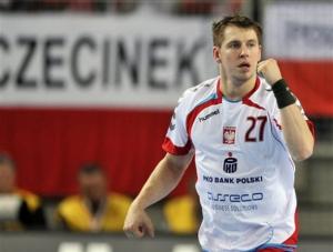 Poland's Rafal Glinski reacts after scoring during the Group