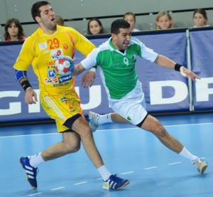 Algeria's Yacine Bouakaz (R) prepares to shoot next to