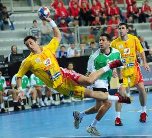 Macedonia's Vladimir Temelkov (L) shoots against Algeria next to