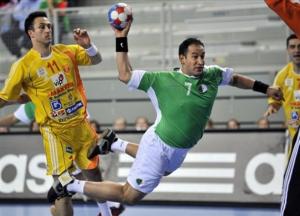 Algeria's Hichem Boudrali, right,  throws in front of
