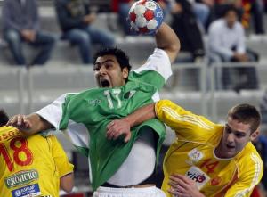 Ali Ahmed Hadj of Algeria attempts to score between