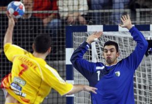 Kiril Lazarov (L) of Macedonia shoots and scores past