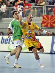 Macedonia's Stevche Alushkovski, right, throws in front of Algeria's