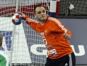 Macedonia's goalkeeper Petar Angelov prepares to pass the ball