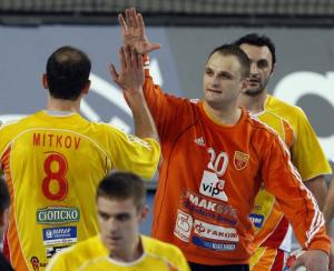 Macedonia's players celebrate their victory against Algeria during their