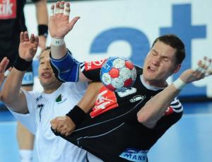 Germany's Sebastian Preiss (R) vies for the ball with