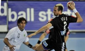 Germany's Pascal Hens, right, throws in front of Algeria's