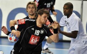 Germany's Michael Kraus, front, throws in front of Germany's