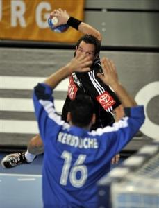 Germany's Torsten Jansen, back, tries to score against Algeria's