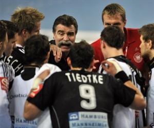 Germany's head coach Heiner Brand speaks in the team