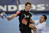 Germany's Martin Strobel, left, and Macedonia's Kiril Lazarov challenge