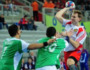 Russia's Vasily Filippov (R) vies for the ball with