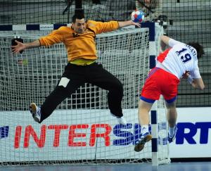 Russia's Samvel Aslanyan (R) shoots against Algeria's goalkeeper Samir