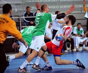 Russia's Samvel Aslanyan  (R) vies for the ball