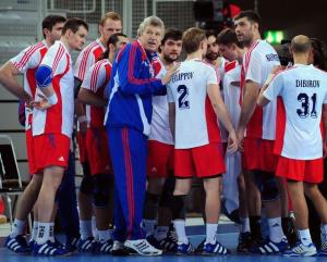 Russia's coach Nicolay Cigarev (C) adresseshis team during