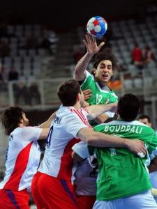 Algeria's Riad Cherbour (C) shoots against Russia during