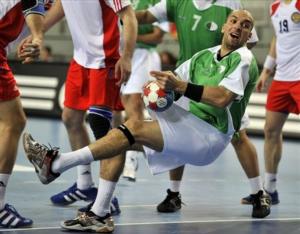 Algeria's Aziz Benkahla throws during the Group C match