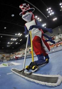 The mascot of the Handball World Championship cleans the