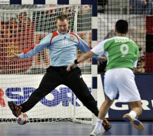 Algeria's Yacinn Bouakaz, right, scores against Russia's goalkeeper Alexey
