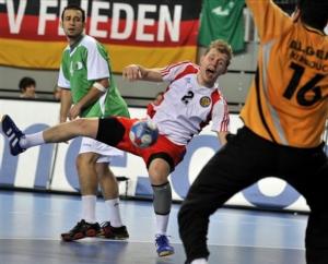 Russia's Vasily Filippov, center, tries to score against Algeria's