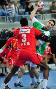 Algeria's Omar Chehbour (R) vies for the ball with