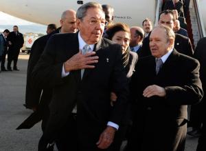 Algerian President Abdelaziz Bouteflika (R) escorts his Cuban counterpart