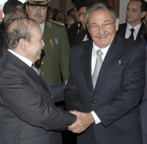 Algerian President Abdelaziz Bouteflika, left, greets Cuban President Raul